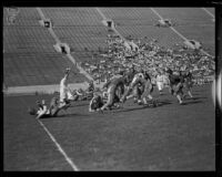 Football game between the Los Angeles Firemen and the Olympic Club at the Coliseum, 1931