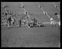 Football game between the Los Angeles Firemen and the Olympic Club at the Coliseum, 1931