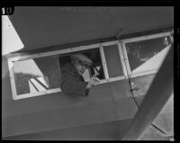 Chief investigator George Contreras, seated in a biplane on his way to Oregon during the hunt for kidnapper and murderer William Edward Hickman, Los Angeles, 1927