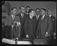 William Edward Hickman, kidnapper and murderer, with law enforcement officers, Los Angeles, 1927-1928