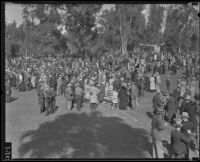 Attendees of the Iowa Picnic in Bixby Park stroll on the lawn, Long Beach, 1935