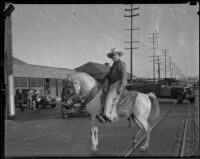 Jay Kellogg, substitute pastor at the Angelus Temple, on horseback, Los Angeles, 1932