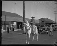 Jay Kellogg, substitute pastor at the Angelus Temple, on horseback, Los Angeles, 1932