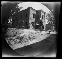 Missionaries' new school building with Samuel Wilson, Annie Wilson, William Whipple and two children, Tabrīz, Iran, 1891