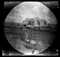 Ruined stone bridge on the road from Tabrīz to Miyaneh with William Sachtleben's bicycle in the foreground, Iran, 1891