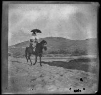 Turkish woman riding a horse on a road, Bursa, Turkey 1895