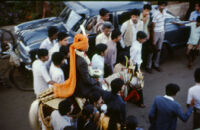 Baraat wedding procession - family members with a bridegroom on a pony, Belgaum (India), 1984