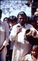 Gangadhar Nagar - villager holding a damaged drumhead, Hubli (India), 1984