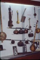 Musical instruments in a museum display case, Mysore (India), 1984