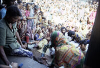 Gangadhar Nagar - Haranśikārī / Haran Shikari community gathered as Gopibai Sivlal, a Kanjar Bhāṭ woman, dances, Hubli (India), 1984