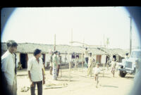 Gangadhar Nagar - men erect a pandal frame, Hubli (India), 1984