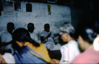 Tiruppati, leader of the Madurai Meenakshi Temple bhajan mandali, leads singing, Madurai (India), 1984