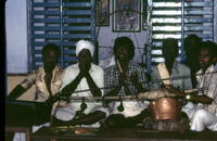 Villupāttu (bow song) ensemble at the temple to Santhanamari, Kottaram (Tamil Nadu, India), 1984