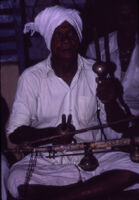 Agasta Lingam Pillai, leader of a Villupāttu (bow song) ensemble at the temple to Santhanamari, Kottaram (Tamil Nadu, India), 1984