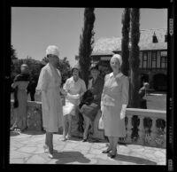 Actress Dana Wynter in the garden of Mrs. Howard Ahmanson, Los Angeles, 1960