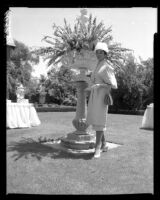 Actress Dana Wynter in the gardens of Mrs. Howard Ahmanson, Los Angeles, 1960