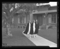 Ensigns Mavis Behrens, Helen Rhoades and Dorothy Olson leave nurses quarters at the Naval Hospital Long Beach to report for duty, Long Beach, 1943.