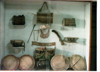 Museum display of nine non-classical membranophones and other musical instruments, Pune (?) (India), 1984