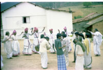 Kota men prepare to dance in an open space at an A. A. Bake playback session, Trichagadi (India), 1984