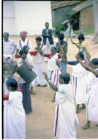 Kota women dance in a circle around Kota men musicians, Trichagadi (India), 1984