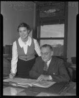 Principal George M. Green and Bernice Pardee review files, Inglewood, 1936