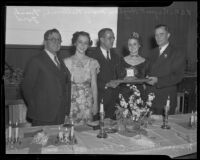 Rupert Hughes, Mary Bellerue, Frank Ford, and C. Elmer Anderson honor Margaret Brown at banquet, South Pasadena, 1936