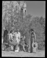 John McEnery, Gordon Coutts, Sir John Lavery and Mrs. John McEnery relax outside Coutt's home, Dar Marroc, Palm Springs, 1936