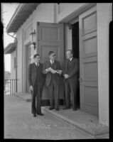 Don T. Delmet, Theodore L. Kistner, and R. R. Applebury stand outside of the brand new Norwalk High School Auditorium, Norwalk, 1936