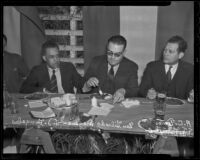 Mexican officials J. J. Gonzales, General Gildardo Magana and A. C. Torres eat at a picnic while discussing trade relations with the U.S., Los Angeles, 1936