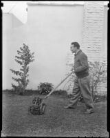 Boxer Jimmy McLarnin mows his lawn, Beverly Hills, 1936