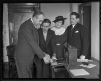 George Rochester, chairman of the county grand jury, gives his fingerprints, along with others, Los Angeles, 1936