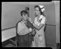 Nurse Marjorie Butler treats patient Warren Sanford Gilbert at Los Angeles County General Hospital, Los Angeles, 1936