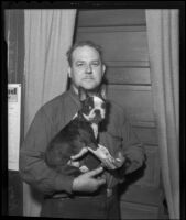 Roy D. Brown and his dog Tumbleweed after they stopped an attempted drugstore robbery, Los Angeles, 1936