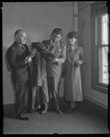 Louis Rifkin, Judge Joseph Marchetti and Rafaela Ottiano inspect a fur coat, Los Angeles, 1936