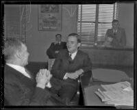 John D. Spreckels III with lawyers during divorce suit, Los Angeles, 1936