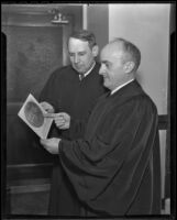 Judges Douglas Lyman Edmonds and Robert Harrison Scott examine a photograph of their ancestors, Los Angeles, 1936