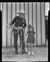 Ken Maynard shows Joan Holt rope tricks, Van Nuys, 1936