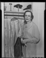 Emilie Biggar stands in front of a closet, Los Angeles, 1936