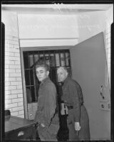 Willard James Turtine is escorted through jail by guard Floyd Mellor, Los Angeles, 1936