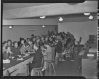 Crowd waits to file their tax returns, Los Angeles, circa 1940