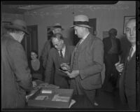 District Attorney John MacDonald and A. J. Gahring at the raid site, South Gate, 1935