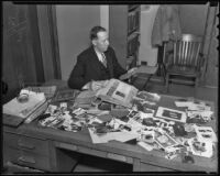 Captain Walter C. "Butch" Allen looks over files from the missing persons' bureau, Los Angeles Police Department, 1935
