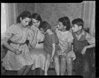 Recently widowed Ina Secrest mourns the death of her husband with her children, Vontella Secrest, Lois Secrest, Juanita Secrest, and Ray Secrest, Los Angeles, 1935
