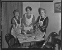 Cecile Appleton, Edna Cobb, and Exa Link prepare for the Ebell Club Christmas party, Los Angeles, 1935