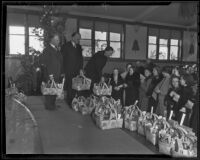 Samuel E. Gates, Rowe Sanderson and Col. Arthur D. Jackson help the needy, Los Angeles, 1935