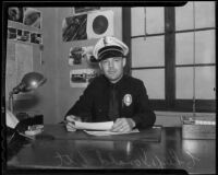 Police Chief Donald Ott works at his desk, Arcadia, 1935