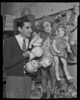Don DaCosta fixes the broken doll of 4-year-old Phyllis Thomson, Los Angeles, 1935