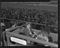 Dickey Dell Doheny sits in a reserved box at Santa Anita Park on opening day, Arcadia, 1935