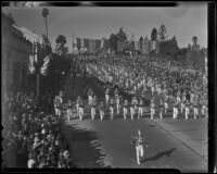 Marching band and automobile with sign reading 