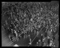Throngs celebrate New Year's 1936 in the streets of downtown, Los Angeles, 1935 or 36